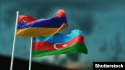 Two flags of Armenia and Azerbaijan fluttering in the wind.