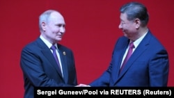 Президент Китаю Сі Цзіньпін і російський лідер Володимир Путін. Пекін, 16 травня 2024 року.
