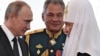 Президент Росії Володимир Путін, міністр оборони Росії Сергій Шойгу і Московський патріарх Кирило. Петербург, 30 липня 2017 року 