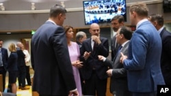 French Foreign Minister Jean-Noel Barrot (center) speaks with European counterparts in Brussels on June 23.