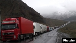 Georgia - Armenian trucks are lined up on a road leading to the Georgian-Russian border crossing at Upper Lars, 6May2016.