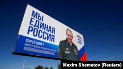 RUSSIA - A truck drives past a campaign poster of the United Russia political party ahead of the Russian parliamentary and regional election outside Ulan-Ude, Buryatia republic, September 16, 2021.
