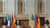(Зліва направо) Мар’яно Рахой, Франсуа Олланд, Анґела Меркель та Маріо Монті, Брюссель, 22 червня 2012 року