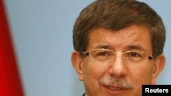 Turkish Foreign Minister Ahmet Davutoglu (in file photo) reportedly met with Israeli Trade Minister Binyamin Ben Eliezer.