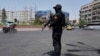 یک نیروی امنیتی سپاه در میدان انقلاب تهران، سه‌شنبه سوم تیرماه