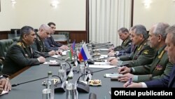 Russia - Defense Minister Sergey Shoygu (R) meets with his Azerbaijani counterpart Zakir Hasanov in Moscow, 15June2016.
