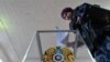 Kazakhstan-A woman votes during parliamentary elections in the Kazakh city of Baikonur