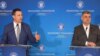 Premierul Marcel Ciolacu (d) și ministrul Finanțelor, Tanczos Barna (s).